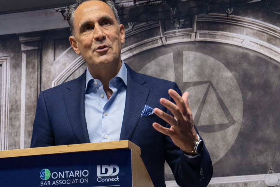 Louis Frapporti speaking at an Ontario Bar Association podium