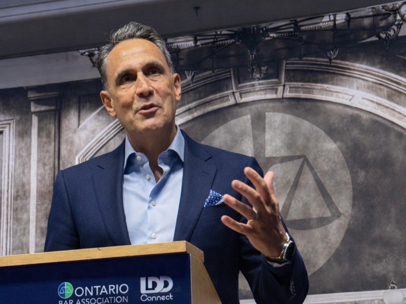 Louis Frapporti speaking at an Ontario Bar Association podium